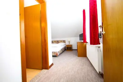 an open door to a bedroom with a bed at Hard Rock Rooms for two in Livno