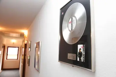 a cd hanging on a wall in a hallway at Hard Rock Rooms for two in Livno