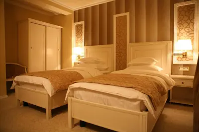 a bedroom with two beds in a room at Hotel Villa Viktorija in Banja Luka