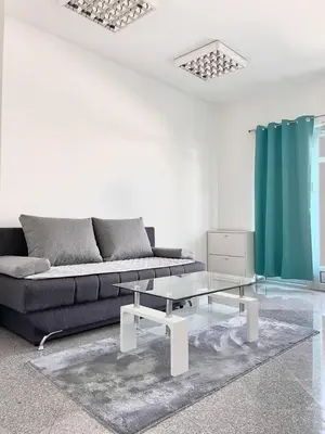 a living room with a couch and a glass table at Apartman Nikolic,Banja Vrucica,Teslic in Teslić