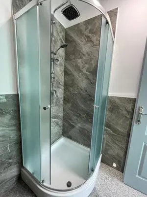 a shower with a glass door in a bathroom at Apartman Nikolic,Banja Vrucica,Teslic in Teslić