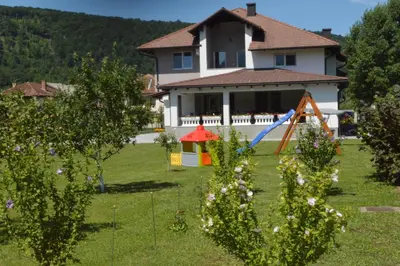 a house with a yard with a play set at Amal Grand Villa in Bihać