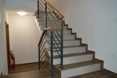 a metal spiral staircase in a house at Amal Grand Villa in Bihać