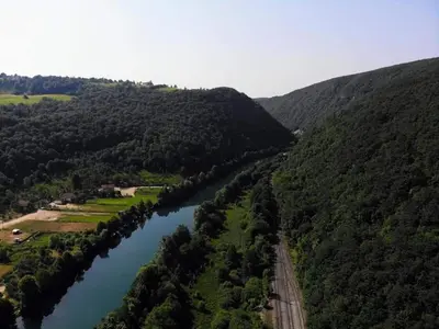 an aerial view of a river with trees and a road at Seosko domacinstvo Halil & Alema in Ćukovi