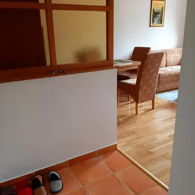 a view of a living room with a table at Relax Apartman sa garažom in Fojnica