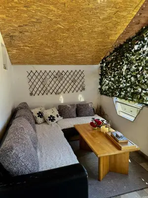 a living room with a couch and a table at Apartment Dil in Kulen Vakuf
