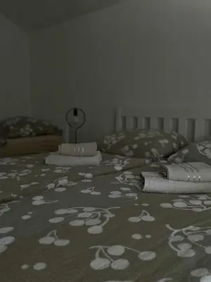 a bed with a blanket with towels on it at Apartment Dil in Kulen Vakuf