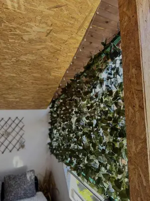 a wall filled with plants on a wall at Apartment Dil in Kulen Vakuf