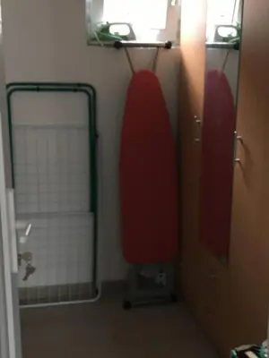 a bathroom with a red seat and a mirror at Luxury apartment in the heart of Jajce in Jajce