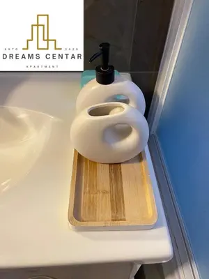 a white toilet sitting on top of a counter at Apartments Dreams Centar in Živinice