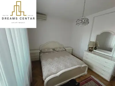 a small bedroom with a bed and a mirror at Apartments Dreams Centar in Živinice