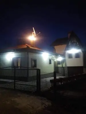 a house with lights on top of it at night at Villa Happy dreams in Bihać