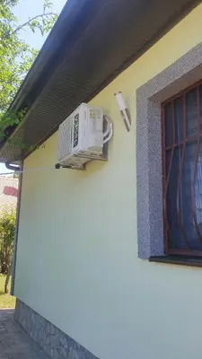 a air conditioner on the side of a building with a window at Villa Happy dreams in Bihać