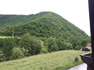 a view of a mountain from a train window at Apartmani Tajra in Visoko