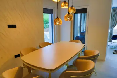a conference room with a wooden table and chairs at Casa Dellˇ Amore in Bihać
