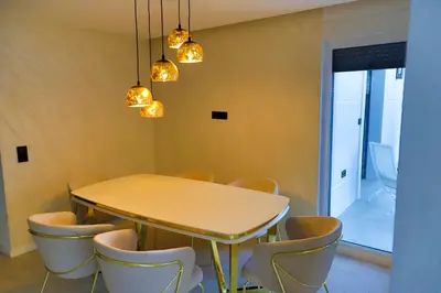 a dining room with a table and chairs at Casa Dellˇ Amore in Bihać