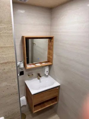 a bathroom with a sink and a mirror at Villa Aroma 2 in Orašje