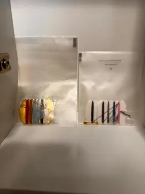a white refrigerator with a box with towels in it at Villa Aroma 2 in Orašje