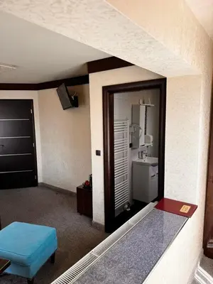 a room with a door to a bathroom with a sink at Villa Aroma 2 in Orašje