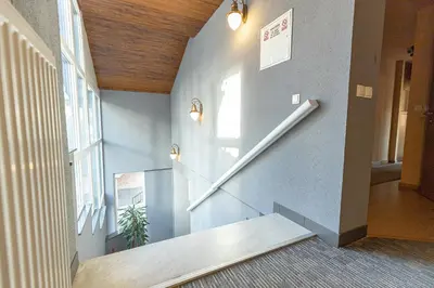 a hallway with stairs in a building at So&sol boutique Hotel, Tuzla in Tuzla