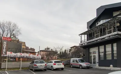 a group of cars parked in a parking lot at So&sol boutique Hotel, Tuzla in Tuzla