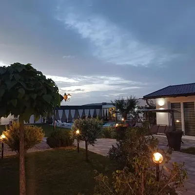a view of a yard with lights and a building at Family estate Hadžalova avlija in Bihać
