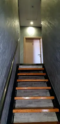a set of stairs leading to a door in a building at Apartman Campari in Banja Luka