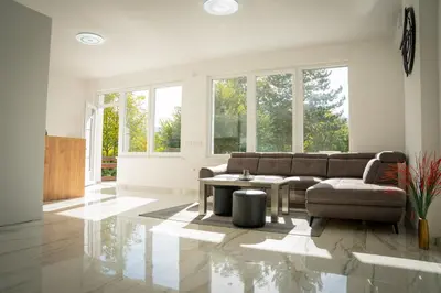 a living room with a couch and a table at Apartment Una Laguna in Bihać