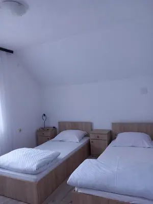 two beds sitting next to each other in a room at Jovan in Šipovo