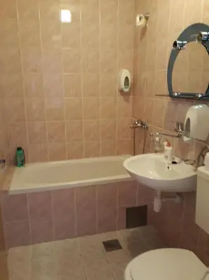 a bathroom with a tub and a sink and a toilet at 