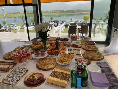 a table with a buffet of food on it at Mediteran B&B in Prozor