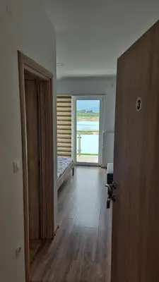 an open door to a room with a view of the ocean at Mediteran B&B in Prozor