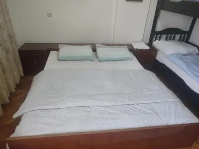 two twin beds in a room with two pillows at Apartman Retro Una in Banja Luka