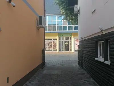 a hallway of a building with a person standing in the doorway at Apartment Kapetanovic in Bosanski Šamac