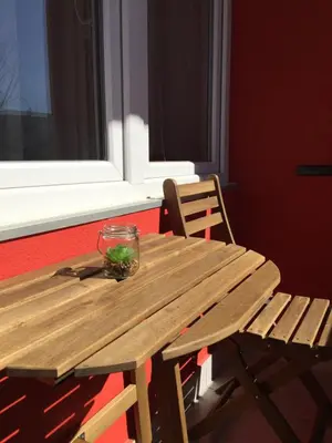 a wooden picnic table with a glass bowl on it at Stan na dan Gradiška/Bos. Gradiška in Bosanska Gradiška