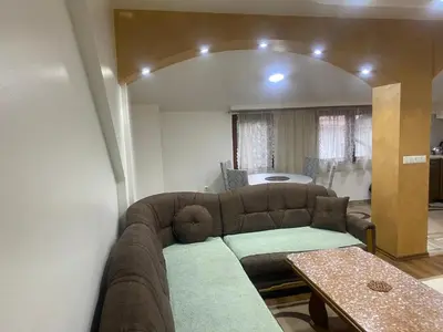 a living room with a couch and a table at Apartment Poturmahala in Travnik