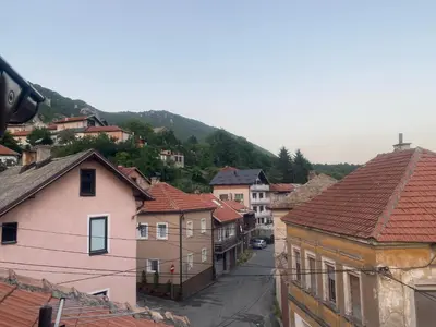 a view of a town with houses and a mountain at Apartment Poturmahala in Travnik
