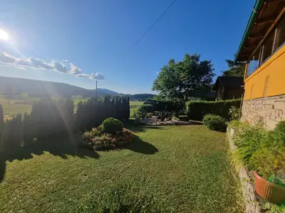 a view of a yard with a house at Green Forest in Vlasic