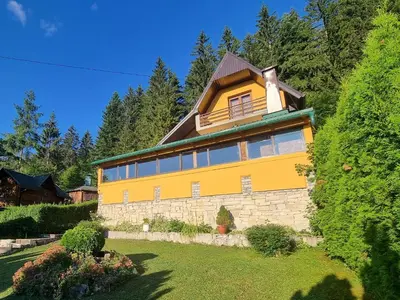 a large yellow house with a lot of windows at Green Forest in Vlasic