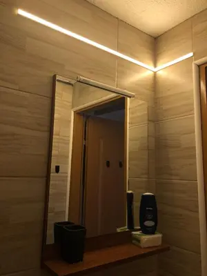 a mirror on a wall in a bathroom at Ammirevole -MOON- Apartment in Visoko