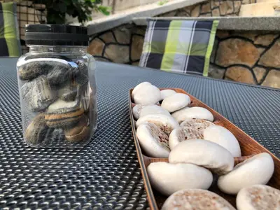 a jar of donuts next to a tray of donuts at Ammirevole -MOON- Apartment in Visoko