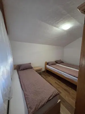 a small room with two beds in it at Biser-Hatinac in Bihać