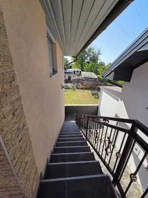 a staircase leading up to a building at Biser-Hatinac in Bihać