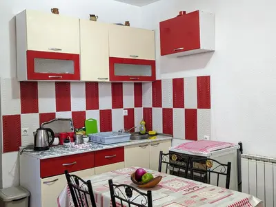 a kitchen with a table with a bowl of fruit on it at Apartment LAMI - Kalibunar, Travnik in Travnik