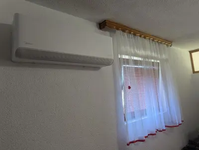 a room with a window and a air conditioner at Apartment LAMI - Kalibunar, Travnik in Travnik