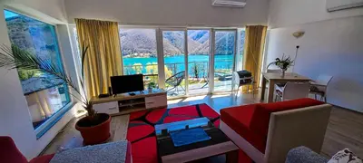 a living room with a large window with a view at Apartment 