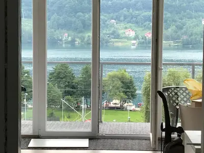 a window with a view of the water at Apartment 