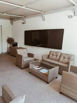 a living room with couches and a flat screen tv at Apartmani Waterfall / Vodopad in Jajce