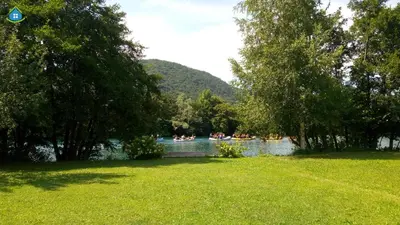 a group of people in boats on a lake at Guest House VEZ Bihac in Bihać