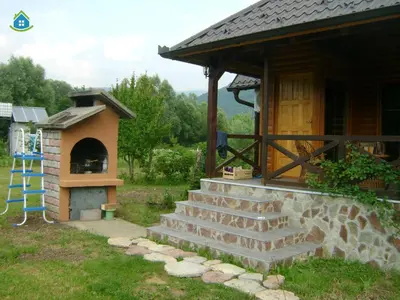 a small cabin with a stairs leading to a oven at Guest House VEZ Bihac in Bihać